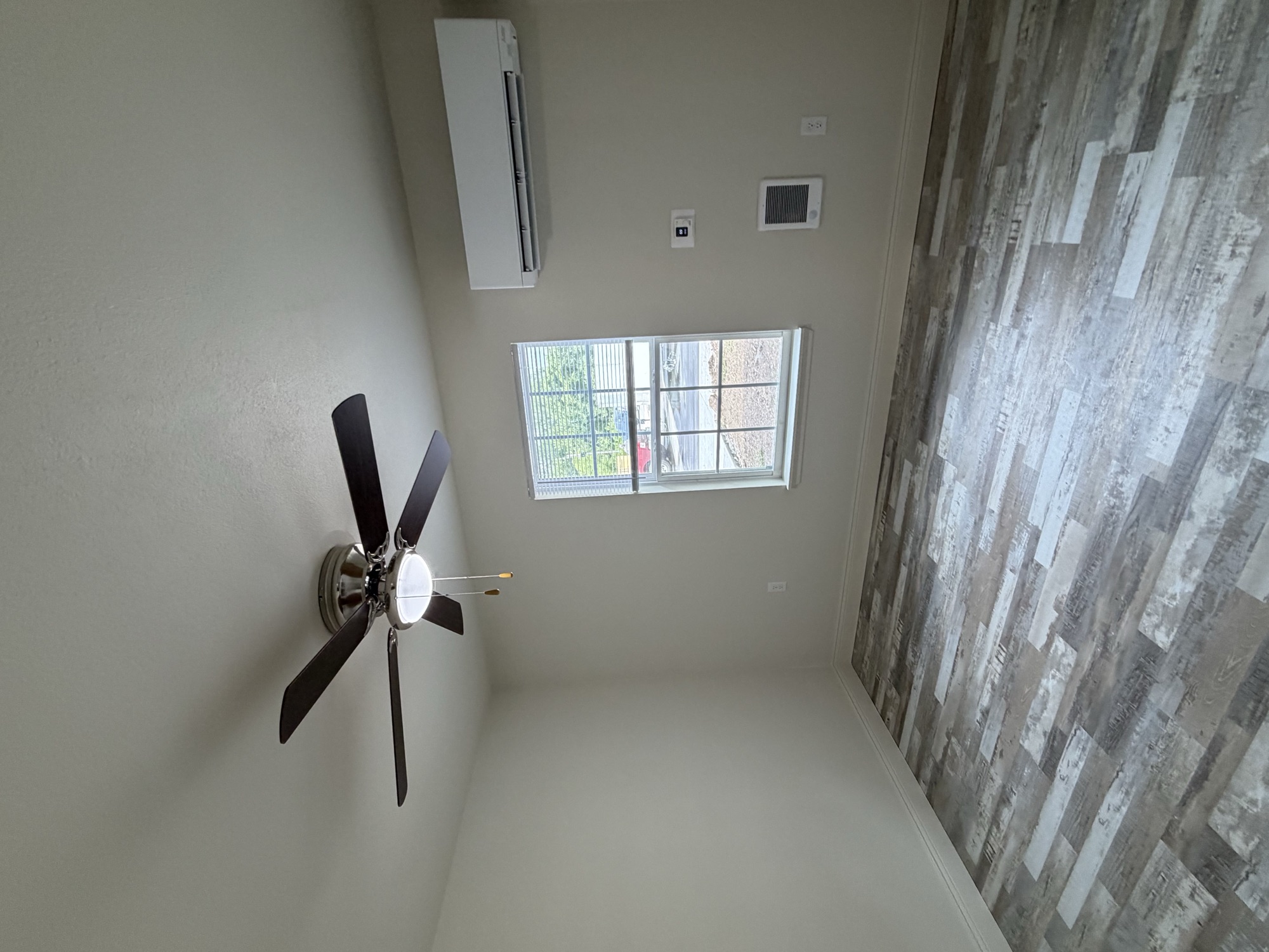 Finished bedroom with new ceiling fan